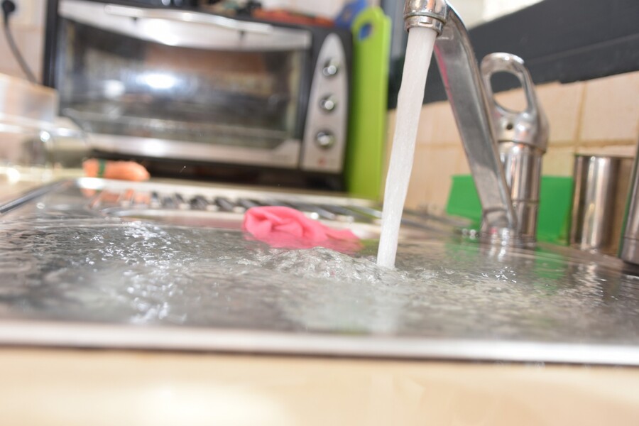 Sink overflowing due to clogged drain ... call American Servicers for drain cleaning.